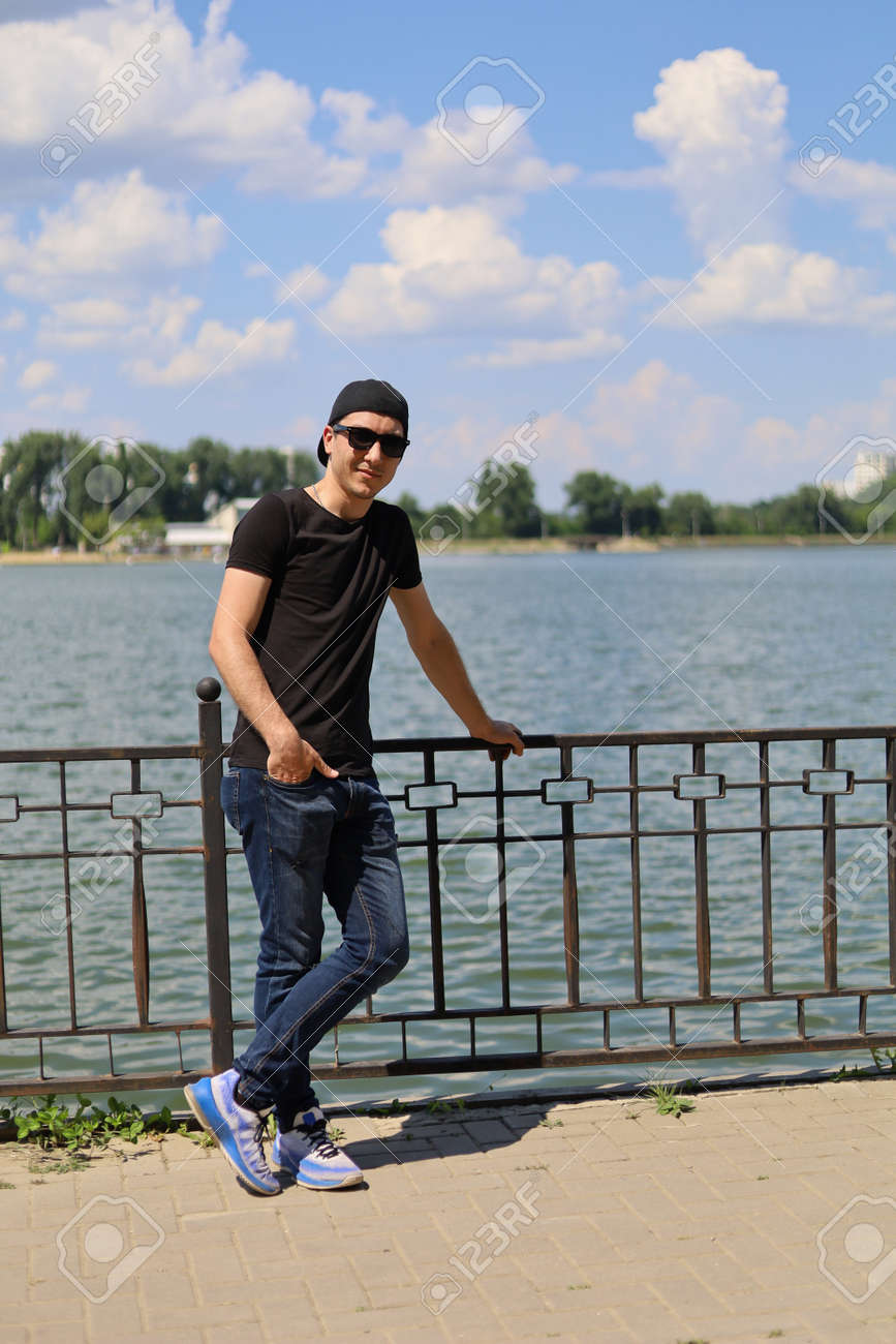 files/152397588-a-young-white-guy-or-man-in-casual-wear-is-enjoying-the-beauty-of-nature-while-being-out-of-town.jpg